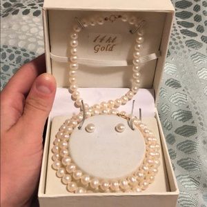 Genuine fw ivory pearls with 14k gold clasps